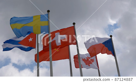 Various national flags with the EU flag under a blue sky. Various national flags with the EU flag under a blue sky. 87124887