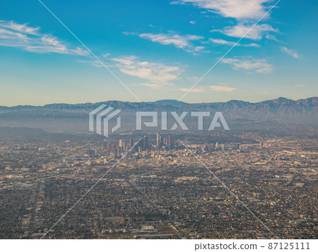 Aerial view of Los Angeles downtown, view from window seat in an airplane Aerial view of Los Angeles downtown, view from window seat in an airplane 87125111