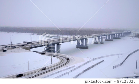 Bridge with cars at the entrance to Barnaul Russia 87125323