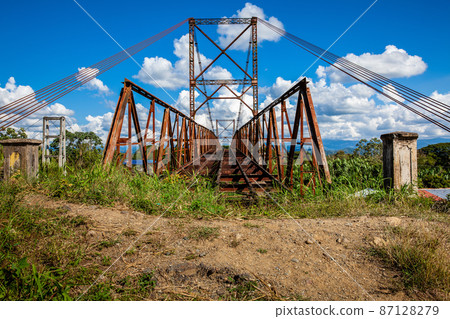Abandoned bridge between Roldanillo and Zarzal at the region of Valle del Cauca in Colombia 87128279