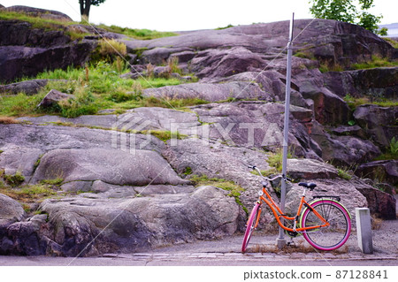 Colorful bicycles on the roadside in Finland Colorful bicycles on the roadside in Finland 87128841