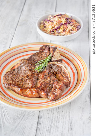 Pan-fried T-bone steak with fresh rosemary Pan-fried T-bone steak with fresh rosemary 87129631