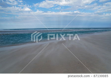 Sand flowing on the beach Sand flowing on the beach 87130085