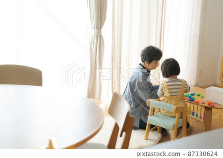 Grandma and grandson back view Grandma and grandson back view 87130624