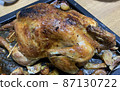 A roasted whole chicken. 87130722