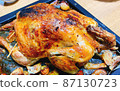 A roasted whole chicken. 87130723