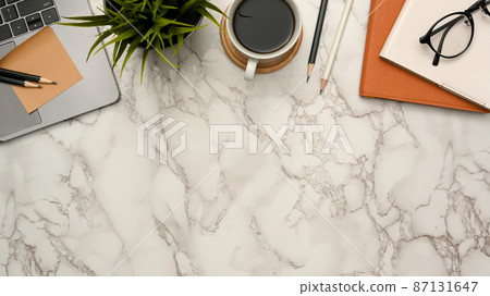Office desk with office supplies and copy space on marble background. 87131647