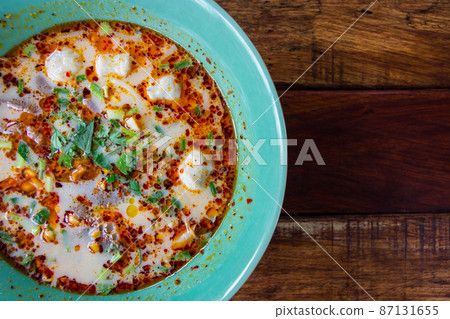 Tom Yam Koong soup with noodles 87131655