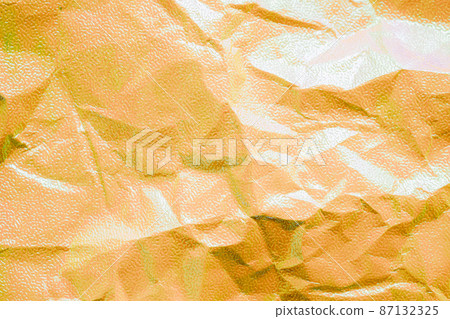 Crumpled shiny yellow paper texture 87132325