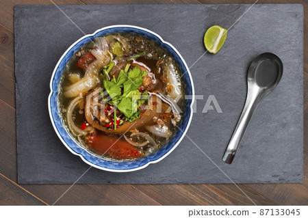 Oxtail soup, traditional muslim food with ox tail puree with spices 87133045