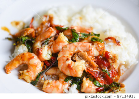 Stir fried shrimp, Cooked rice and fried basil with shrimps prawns,Thai food rice topped shrimp with holy basil leaves 87134935