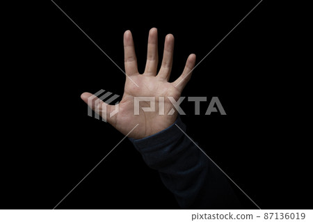 Open hand showing stop sign on black background. copy space. Open hand showing stop sign on black background. copy space. 87136019