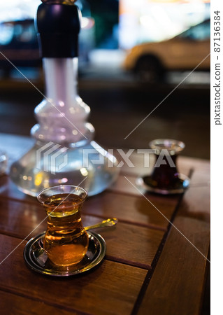 traditional Turkish apple tea and hookah in a hookah bar in Turkey 87136384