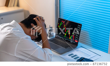 Overwork Concept The male who works in the office holding his head with stressful emotion Overwork Concept The male who works in the office holding his head with stressful emotion 87136732