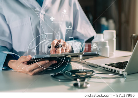 Medicine doctor hand working with modern digital tablet computer interface as medical network concept . 87137996