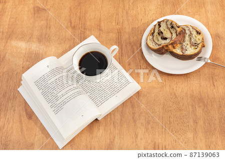 relax cozy objects and background with coffee, bread, a book relax cozy objects and background with coffee, bread, a book 87139063