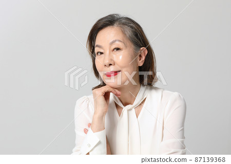Asian Korean senior woman, bold and red cosmetics makeup beauty concept in studio 87139368