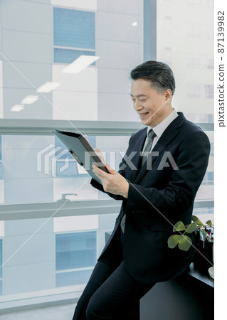 business concept asian korean man, examining the paper 87139982