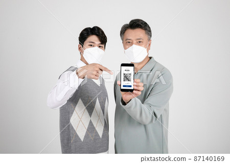 asian korean old and young two men showing vaccine pass 87140169