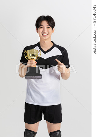 volleyball sports player, asian korean man with trophy volleyball sports player, asian korean man with trophy 87140345