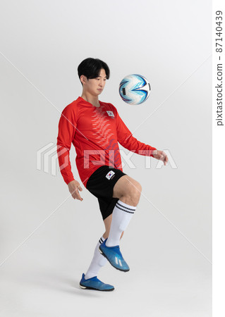 soccer football sports player, asian korean man with motions in studio background soccer football sports player, asian korean man with motions in studio background 87140439