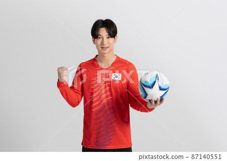 soccer football sports player, asian korean man with motions in studio background soccer football sports player, asian korean man with motions in studio background 87140551