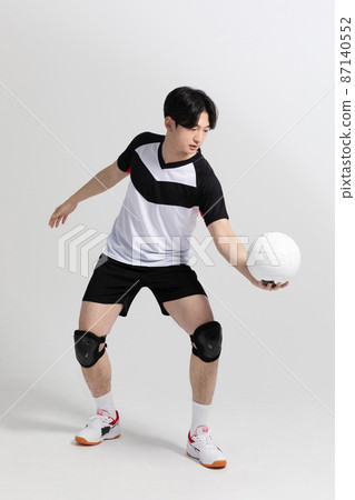 volleyball sports player, asian korean man preparing serve, serving the ball volleyball sports player, asian korean man preparing serve, serving the ball 87140552