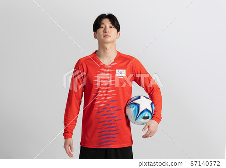 soccer football sports player, asian korean man with motions in studio background 87140572