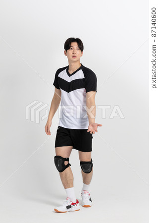 volleyball sports player, asian korean man preparing serve, serving the ball volleyball sports player, asian korean man preparing serve, serving the ball 87140600