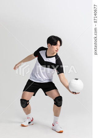 volleyball sports player, asian korean man preparing serve, serving the ball volleyball sports player, asian korean man preparing serve, serving the ball 87140677