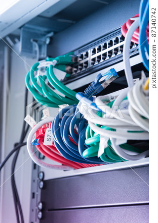 network panel, switch and cables inside internet data center network panel, switch and cables inside internet data center 87140742