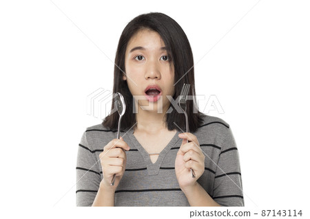 asian woman holding cutlery feel excited expression 87143114