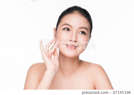 Skin care. Beautiful Young Asian Woman with Clean Fresh Skin touch her face Skin care. Beautiful Young Asian Woman with Clean Fresh Skin touch her face 87145196