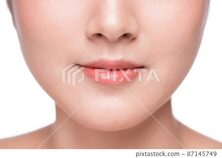 Young asian woman close up. Perfect natural lip makeup Young asian woman close up. Perfect natural lip makeup 87145749