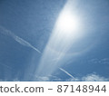 Sun halo and contrails 87148944