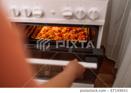 Chicken baked in the oven in glass pan. Homemade food. Chicken baked in the oven in glass pan. Homemade food. 87149641