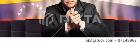 Man on background from oil barrels with Russia and Venezuela flags Man on background from oil barrels with Russia and Venezuela flags 87149962