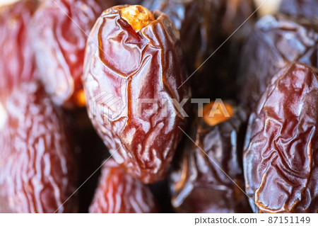 Close up of dried dates fruit. Close up of dried dates fruit. 87151149
