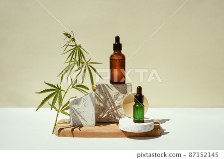 CBD oil, cannabis setting in different bottles and marijuana leaf 87152145