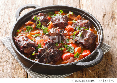 Southern Spain food Rabo de Toro Oxtail Stew with red wine closeup on a pot. Horizontal Southern Spain food Rabo de Toro Oxtail Stew with red wine closeup on a pot. Horizontal 87152170
