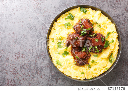 Rabada Oxtail Stew in Red Wine closeup on plate. Horizontal top view Rabada Oxtail Stew in Red Wine closeup on plate. Horizontal top view 87152176