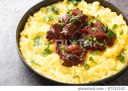 Rabada Oxtail Stew in Red Wine closeup on plate. Horizontal Rabada Oxtail Stew in Red Wine closeup on plate. Horizontal 87152182