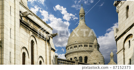 Basilica of the Sacred Heart of Paris, commonly known as Sacre-Coeur Basilica, located in the Montmartre district of Paris, France Basilica of the Sacred Heart of Paris, commonly known as Sacre-Coeur Basilica, located in the Montmartre district of Paris, France 87152373