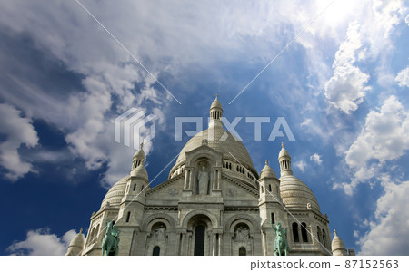 Basilica of the Sacred Heart of Paris, commonly known as Sacre-Coeur Basilica, located in the Montmartre district of Paris, France Basilica of the Sacred Heart of Paris, commonly known as Sacre-Coeur Basilica, located in the Montmartre district of Paris, France 87152563