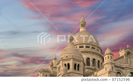 Basilica of the Sacred Heart of Paris, commonly known as Sacre-Coeur Basilica, located in the Montmartre district of Paris, France Basilica of the Sacred Heart of Paris, commonly known as Sacre-Coeur Basilica, located in the Montmartre district of Paris, France 87152596