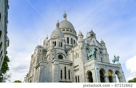 The Basilica of the Sacred Heart of Paris, commonly known as Sacre-Coeur Basilica, located in the Montmartre district of Paris, France The Basilica of the Sacred Heart of Paris, commonly known as Sacre-Coeur Basilica, located in the Montmartre district of Paris, France 87152662