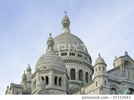 The Basilica of the Sacred Heart of Paris, commonly known as Sacre-Coeur Basilica, located in the Montmartre district of Paris, France The Basilica of the Sacred Heart of Paris, commonly known as Sacre-Coeur Basilica, located in the Montmartre district of Paris, France 87152663
