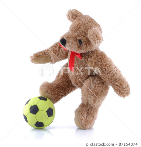 Teddy bear playing football soccer on white background Teddy bear playing football soccer on white background 87154074