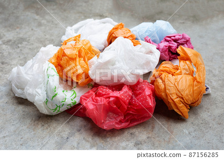 Colorful plastic bags on cement floor Colorful plastic bags on cement floor 87156285
