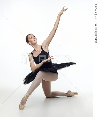 elegant ballerina made a deflection. photo shoots in the studio on a white background 87157054